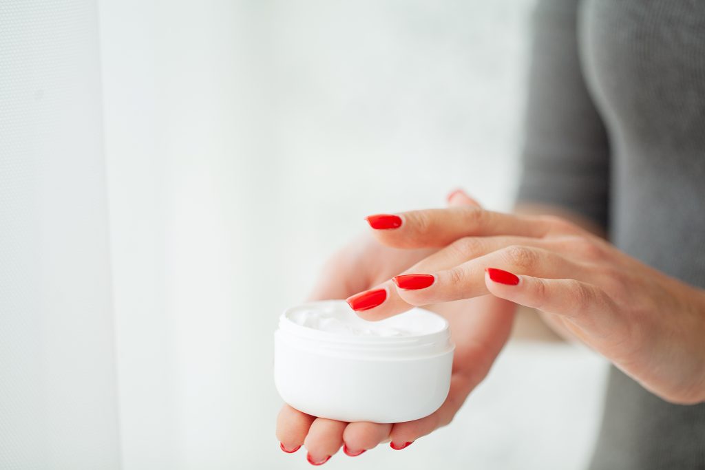 Best Hand Creams for Dry Hands and Cuticles. Hand Skin Care. Close Up Of Female Hands Holding Cream Tube, Beautiful Woman Hands With Natural Manicure Nails Applying Cosmetic Hand Cream On Soft Silky Healthy Skin.