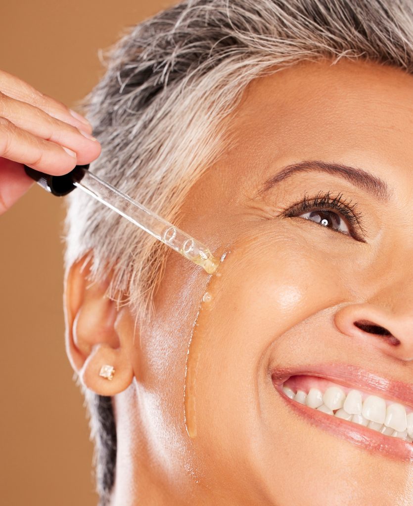 Anti-Aging Ingredients. Skincare, serum and face of senior woman with liquid product for glowing skin hydration, anti aging. Anti-Aging skincare Ingredients.