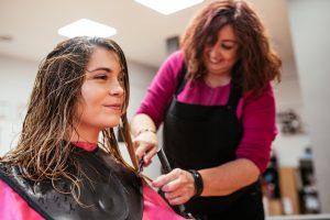 Timeless Haircuts. haircuts. Hairdresser cutting woman's hair