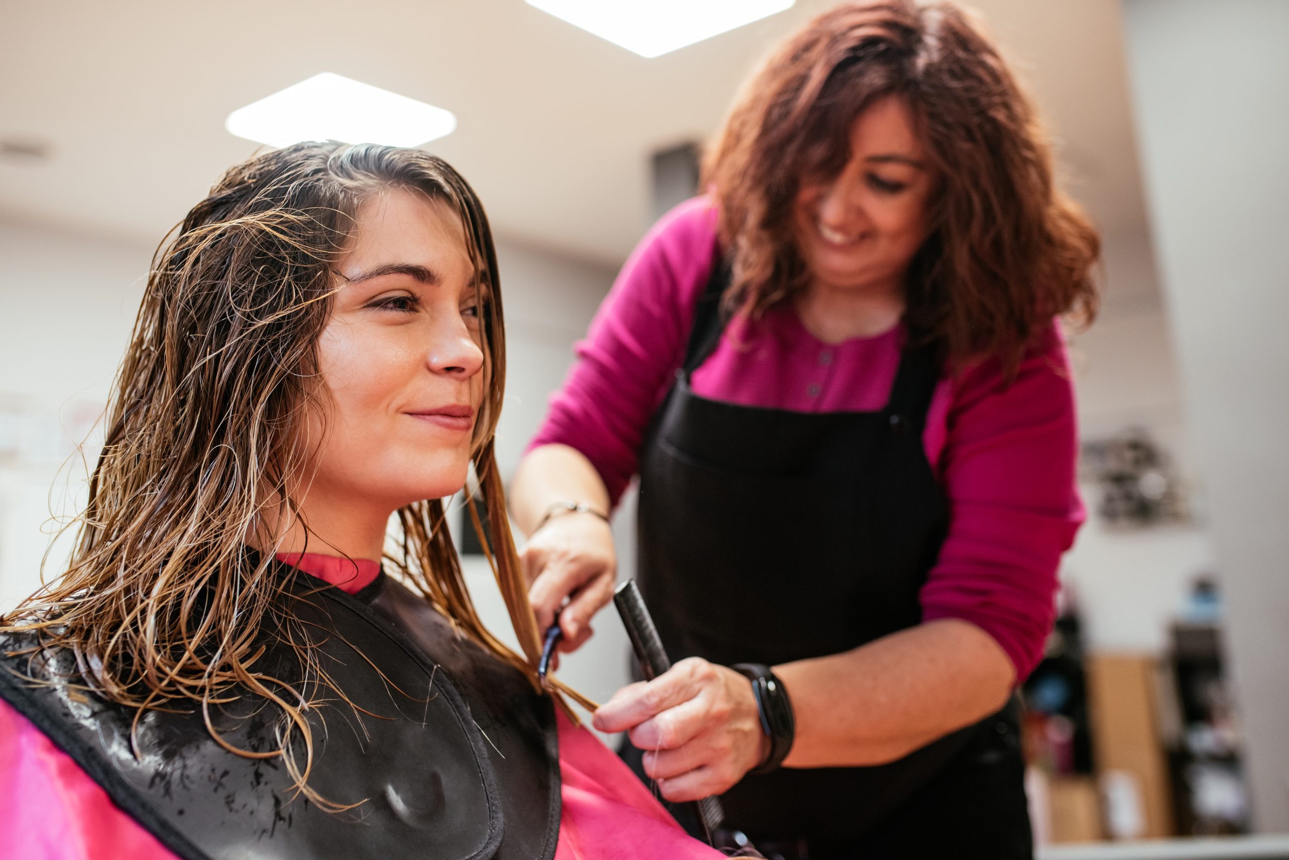 Timeless Haircuts. haircuts. Hairdresser cutting woman's hair