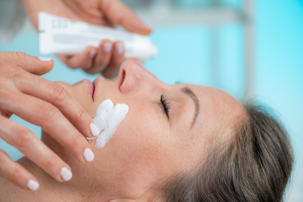 Skin pampering with our dermatology beauty treatment. Applying the cream, leaving skin smooth, refreshed and glowing.