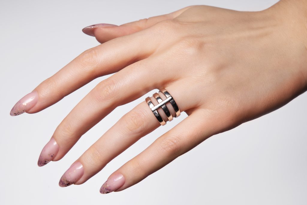 Beautiful white manicure with glitter. High-quality photoBeautiful white manicure with glitter. High-quality photo