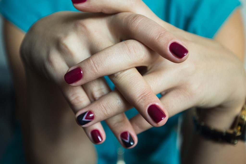 Beautiful woman's nails with beautiful red manicure