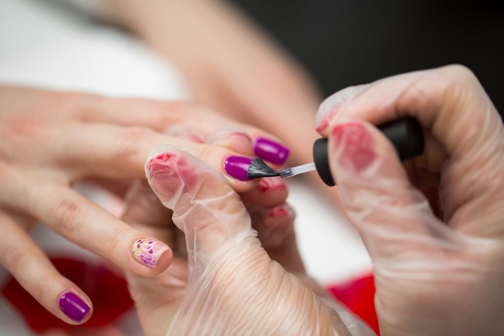 Manicure nail paint pink color