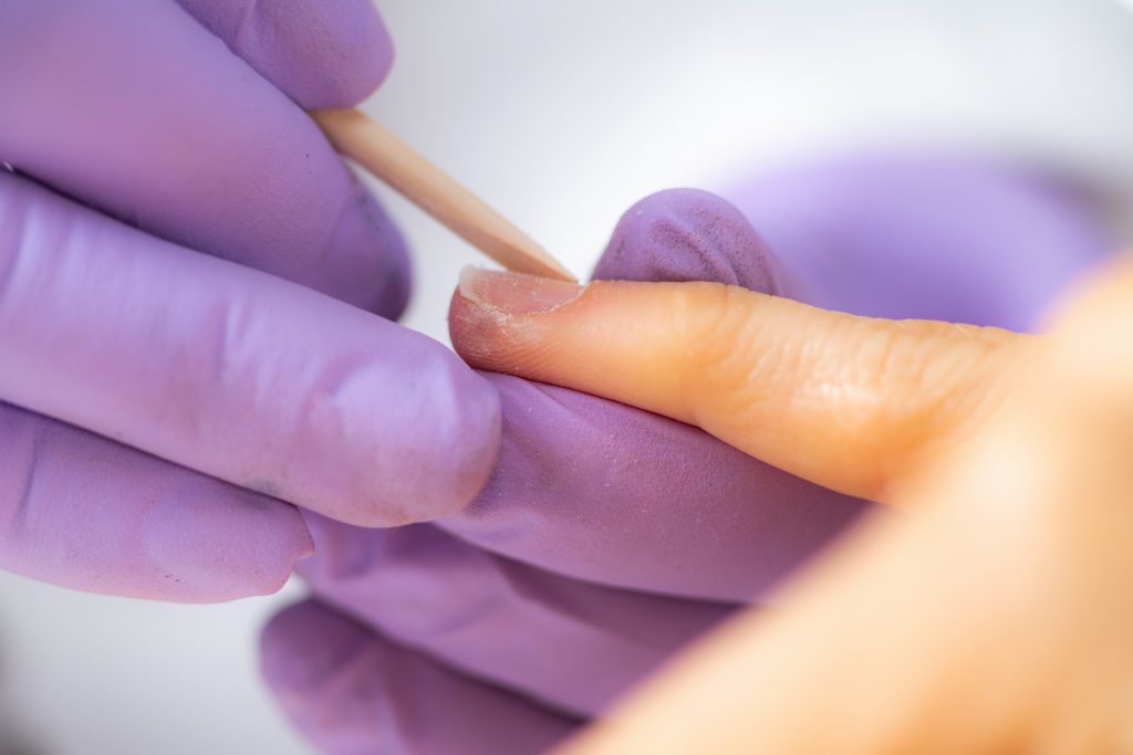 Pushing Fingernail Cuticles in Beauty Salon