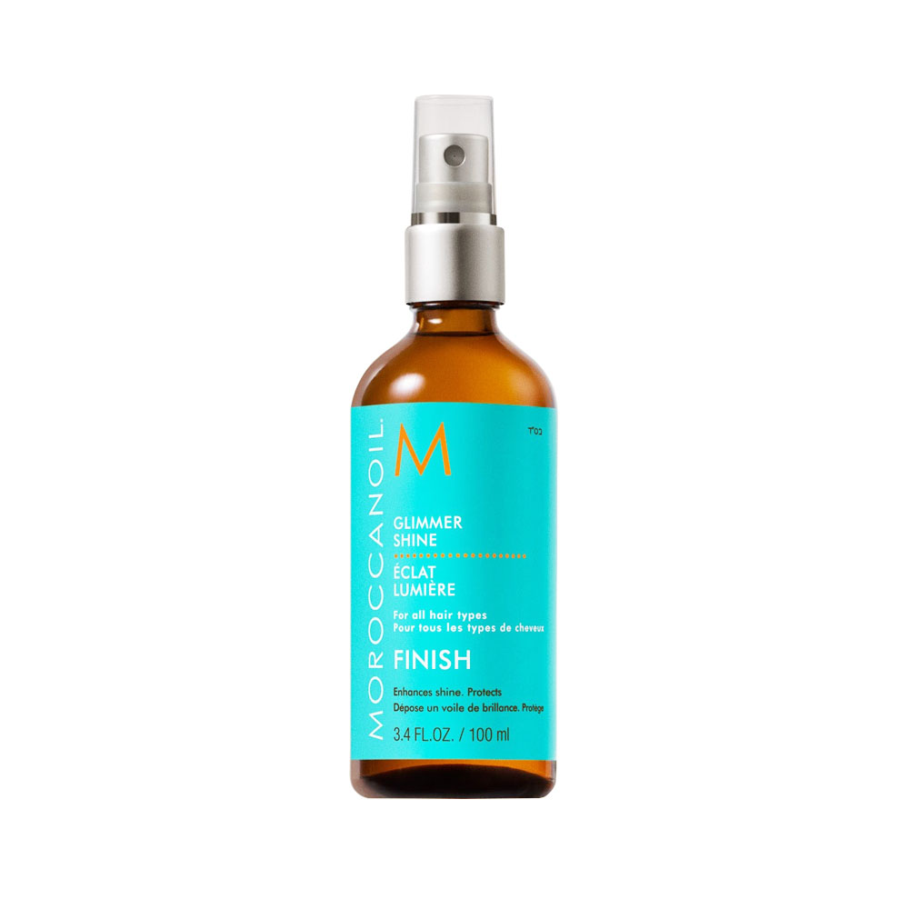 A 100ml bottle of Moroccanoil Glimmer Shine Finish spray, an argan oil-infused finishing mist for all hair types.