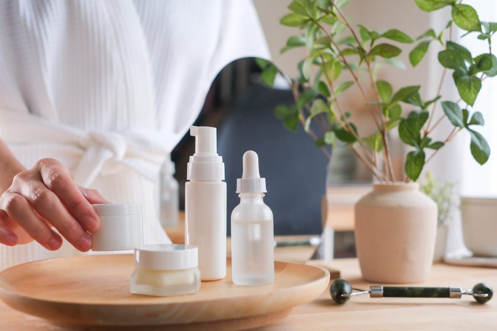 A woman holds the skincare jar. for beauty, wellness, and cosmetic concept.
